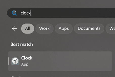 A windows search bar, showing someone search for &quot;clock&quot;.